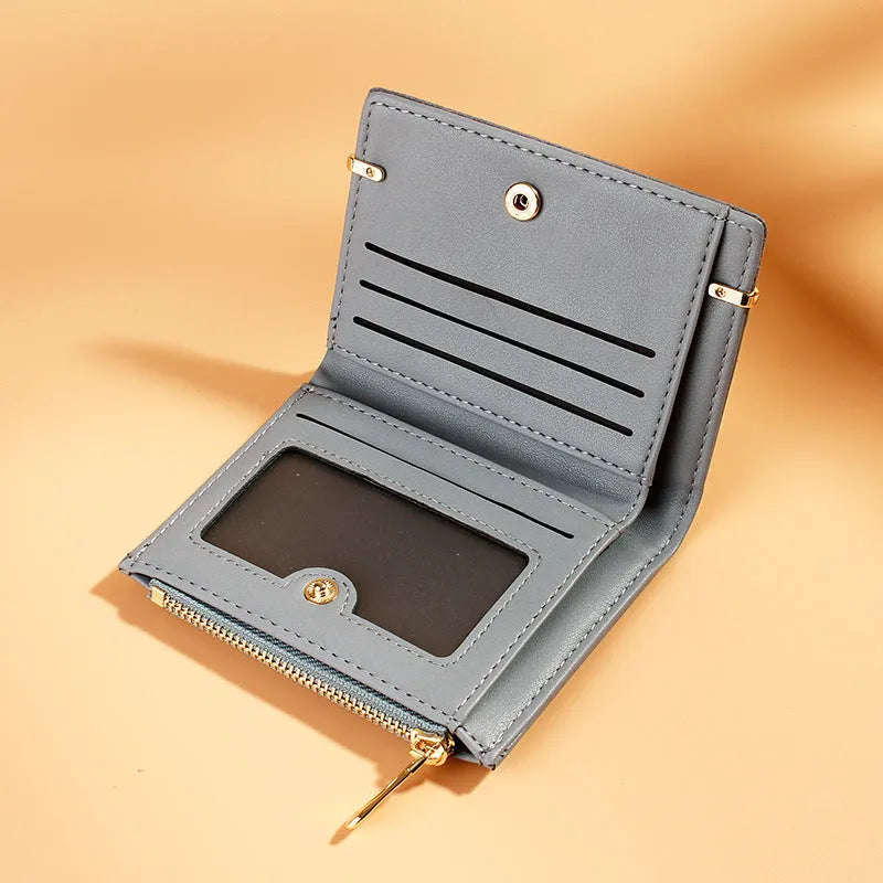 Ladies folding wallet with zipper closure and multiple internal compartments in PU leather