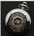 Retro mechanical pocket watch with hollow floral dial and transparent case back showing internal mechanism