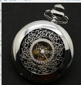 Retro mechanical pocket watch with hollow floral dial and transparent case back showing internal mechanism