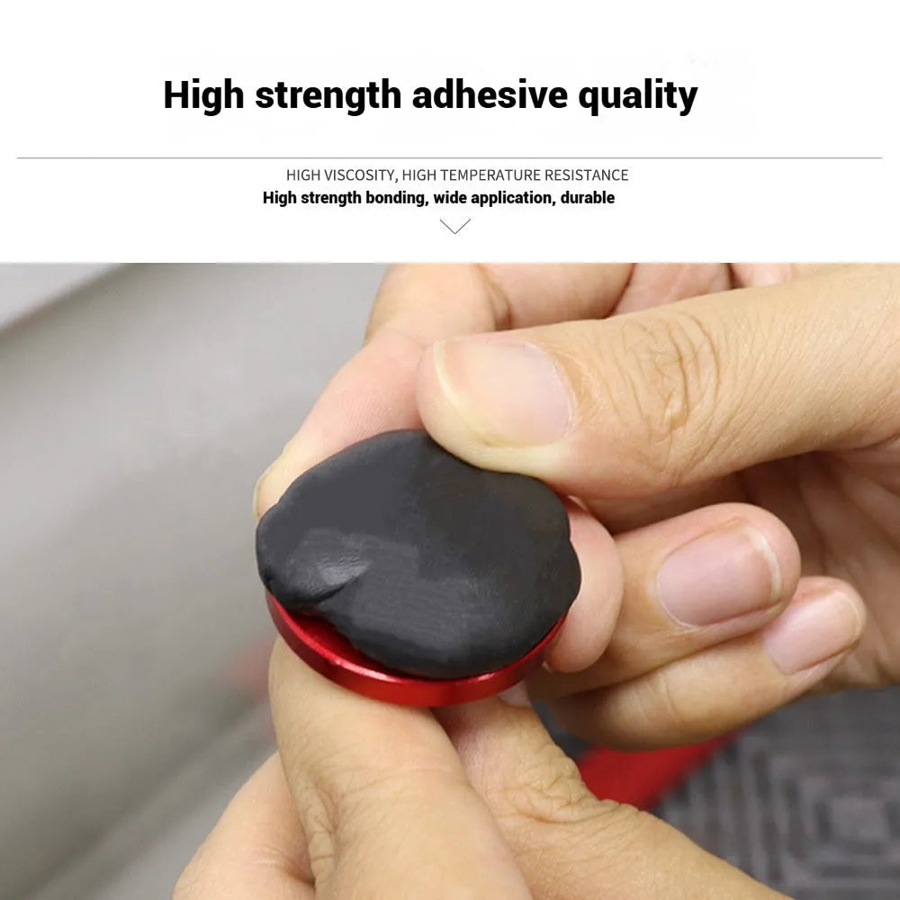 Tube of specialised cold glue for automotive paintless dent repair (PDR) on a car panel.