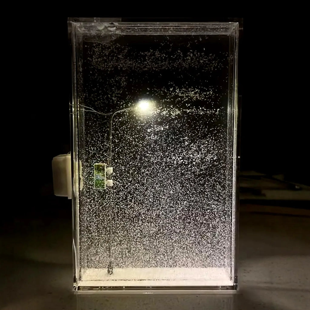 DIY magic snowy landscape night light kit with small street lamp on a desktop