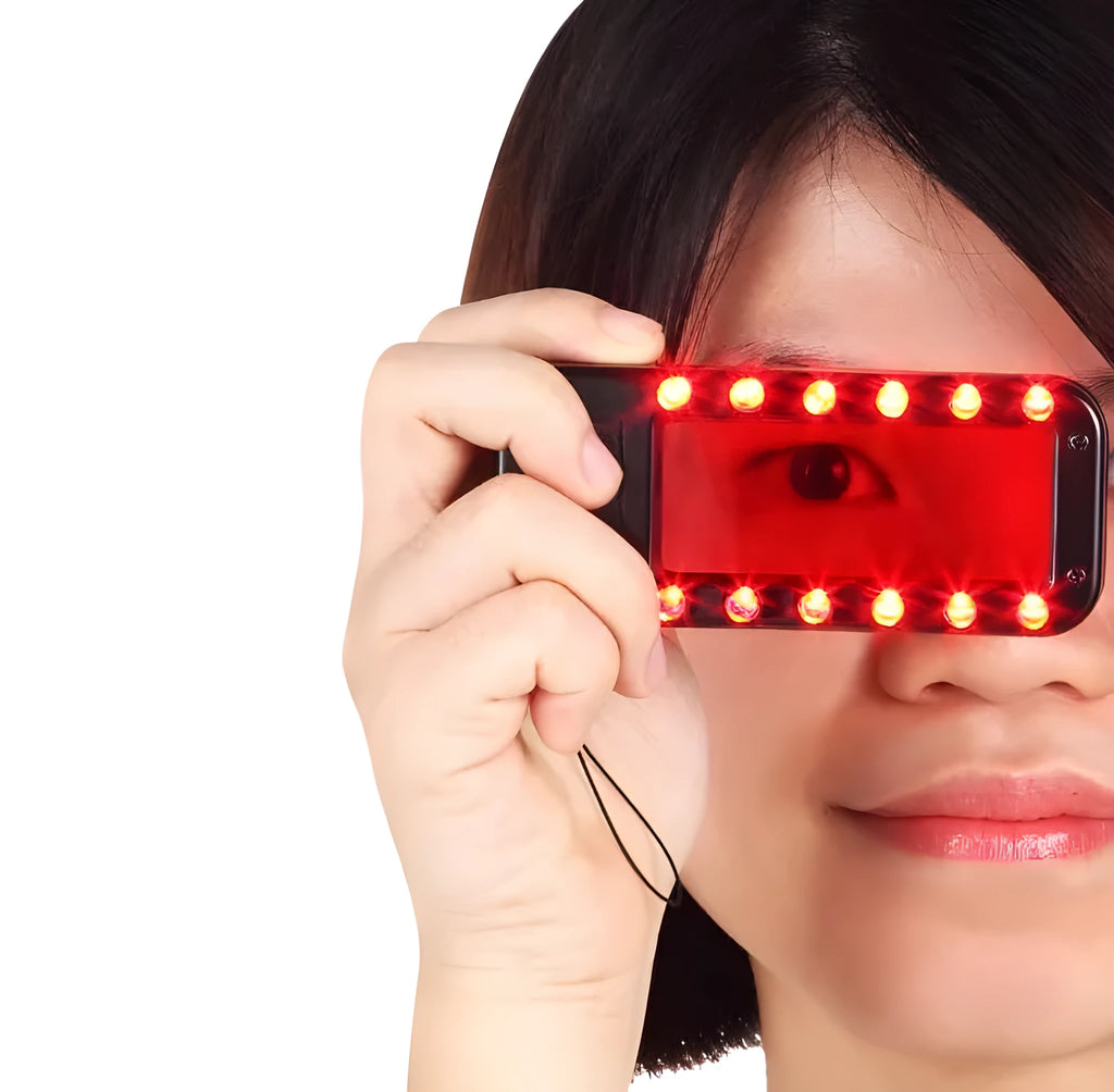 Small red handheld reverse camera detector with scanner for finding hidden surveillance lenses.