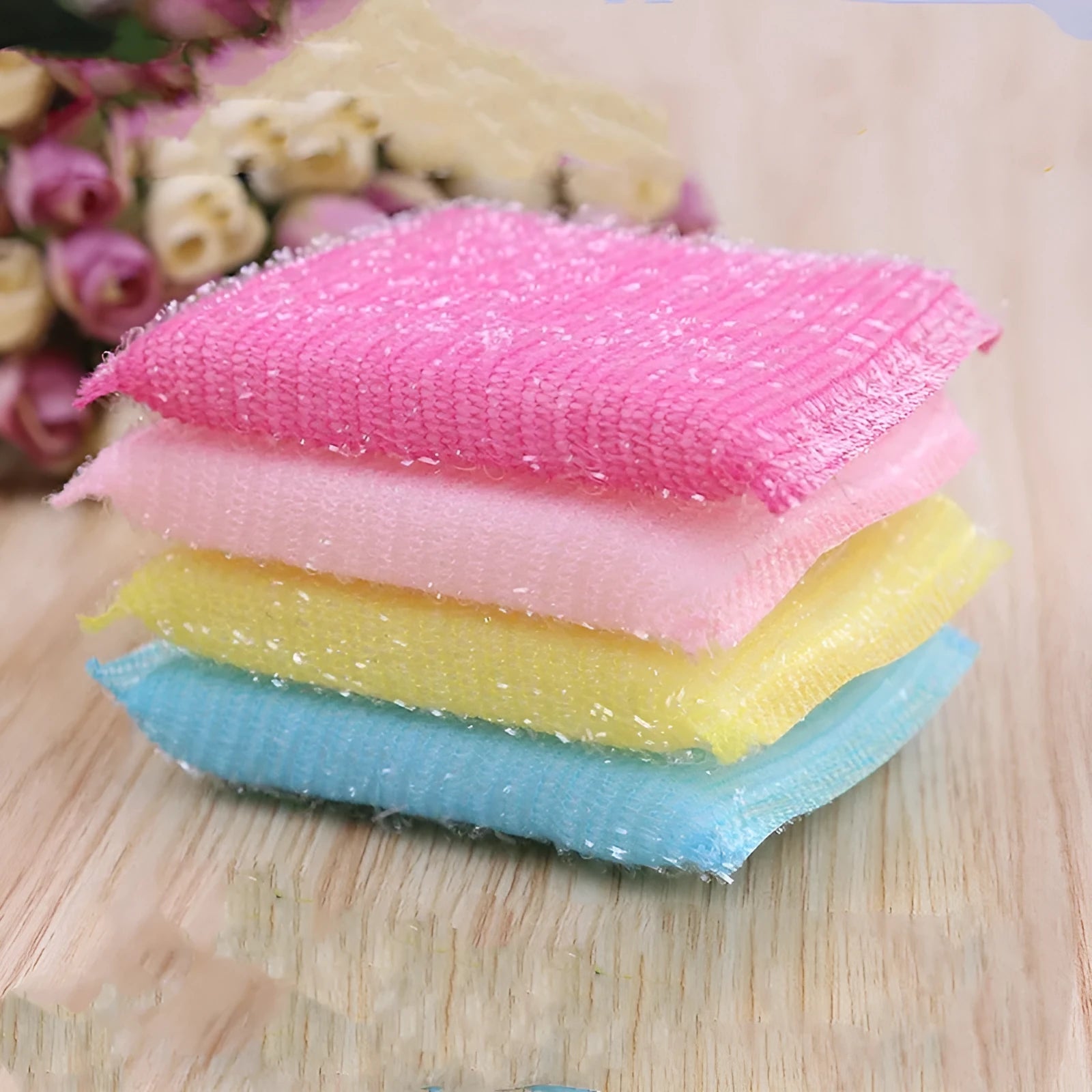 Macaron coloured pinstripe fabric dishwashing sponge mop on a kitchen surface.