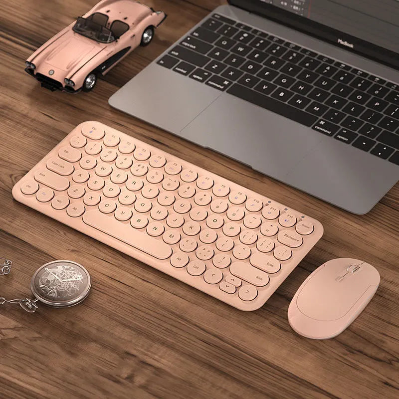 Mute brand ultra-thin wireless keyboard and mouse set with USB receiver on a wooden desk.