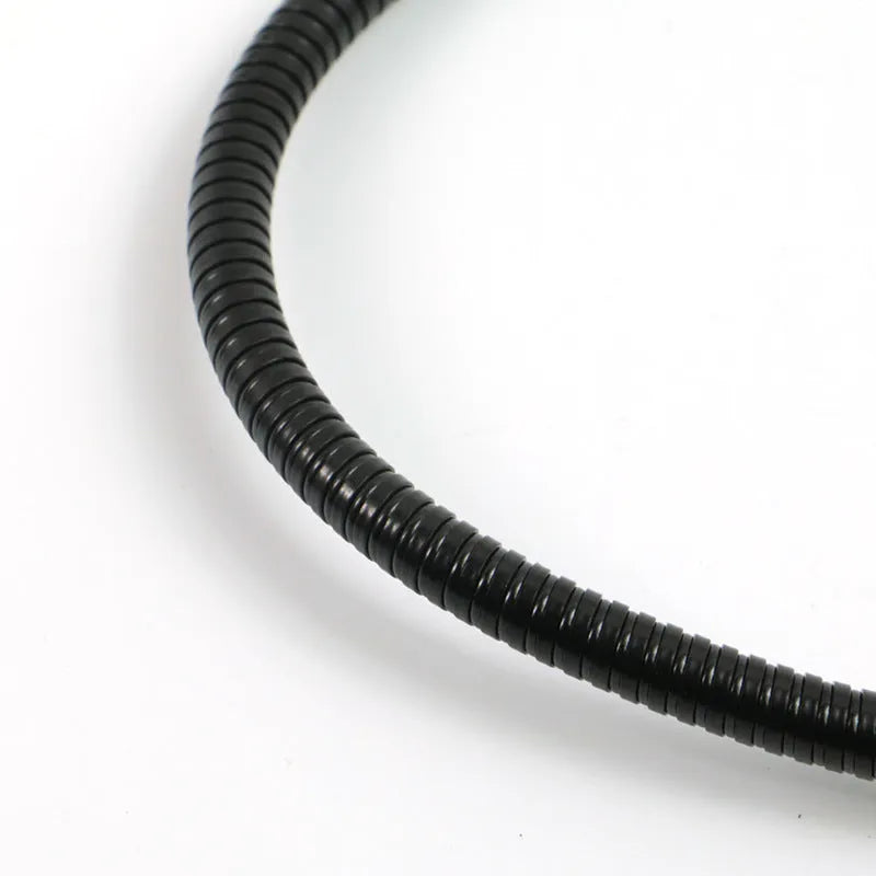 Black microphone anti-spray shock mount with elastic suspension bands on a stand