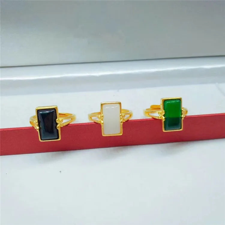Adjustable brass gold-plated ring with a green gemstone inlay in a national style.