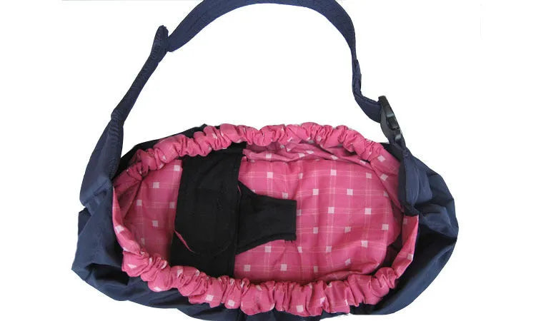 Newborn baby carrier sling with cross-arm one-shoulder strap in blue plaid fabric.