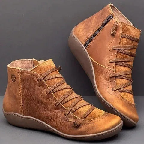 Women's casual flat boots with a wedge heel and round toe in various colours.