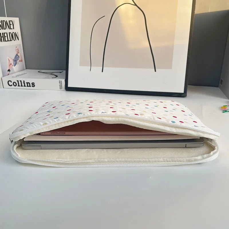 Women's polka dot laptop bag in polyester with breathable construction showing size options