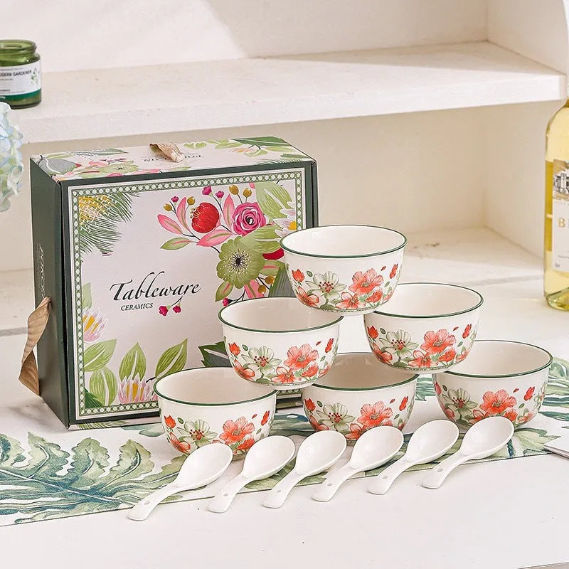 Ceramic tableware gift box set with 4 bowls, 4 spoons, and 2 plates in matching underglaze finish