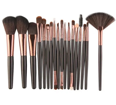 18-piece makeup brush and cosmetics travel set with fan-shaped brushes, packed for resale.