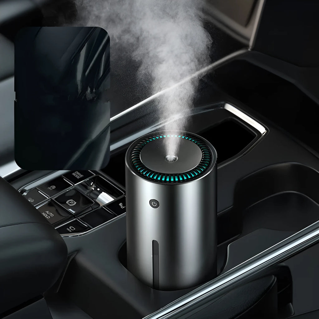 Black aluminium alloy car humidifier and air purifier with USB cable on a car dashboard.