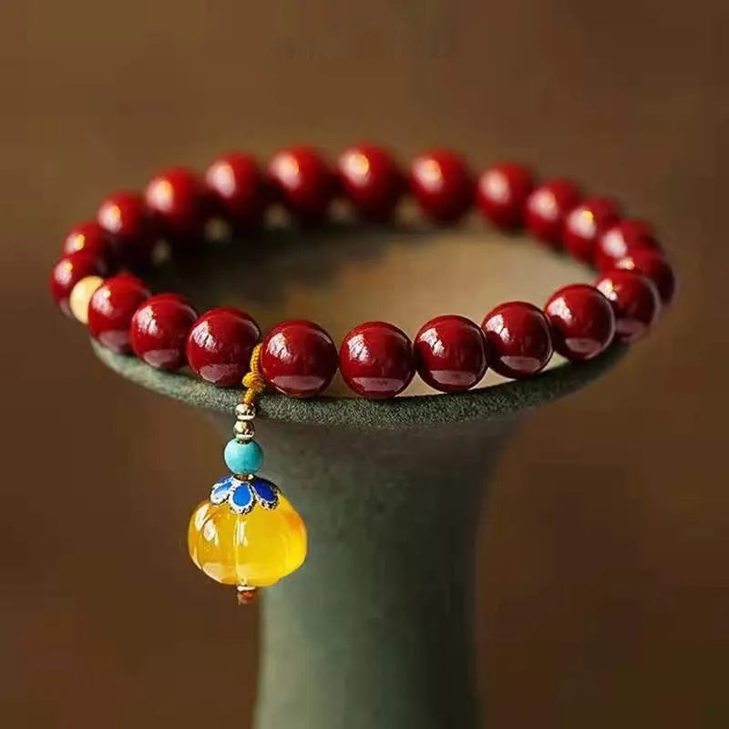 Gold cinnabar bracelet with wave design featuring copper bead accents in national style