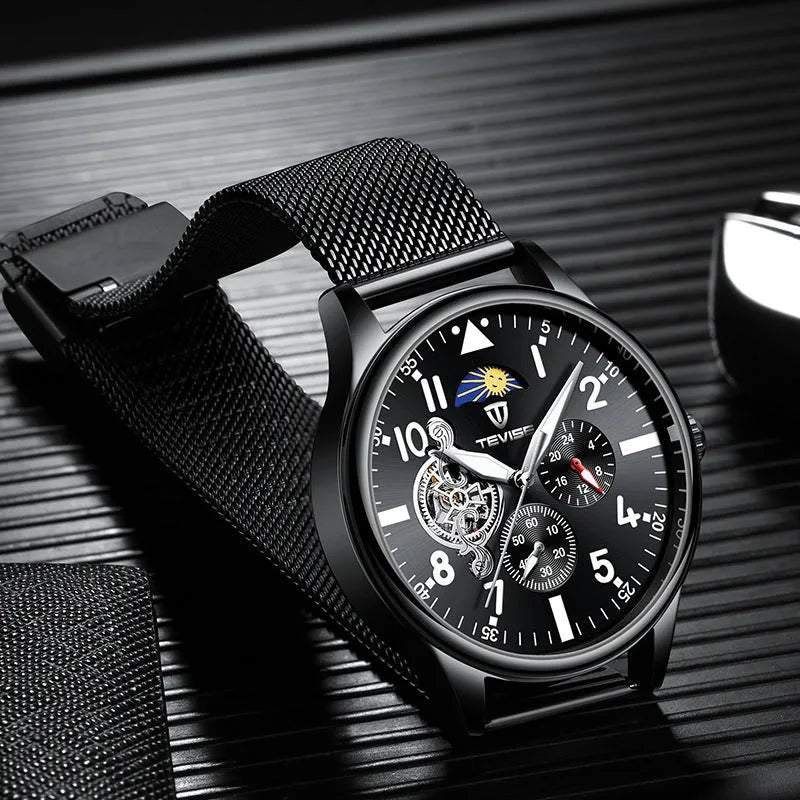 Men's black mechanical watch with moon phase dial and luminous hands on alloy case