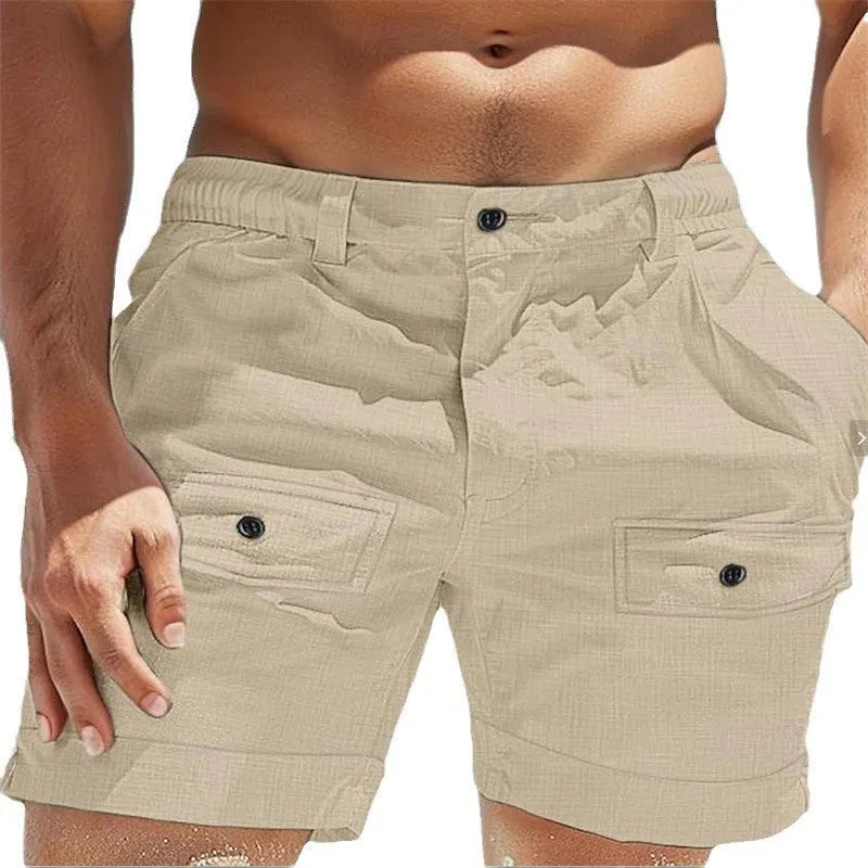 Men's linen shorts in khaki with elastic waistband and button pockets laid flat.