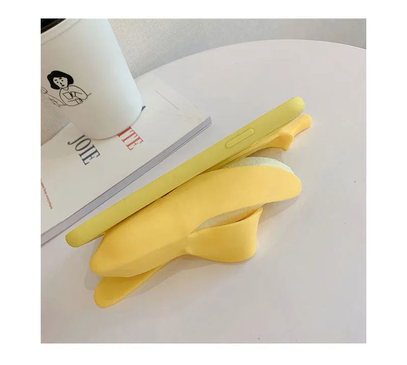 Unzip banana silicone phone case in bright yellow for iPhone, showing realistic unzip detail and soft TPU back protector