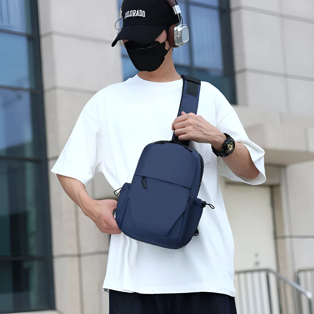 Men's grey waterproof chest bag showing front compartment and shoulder strap