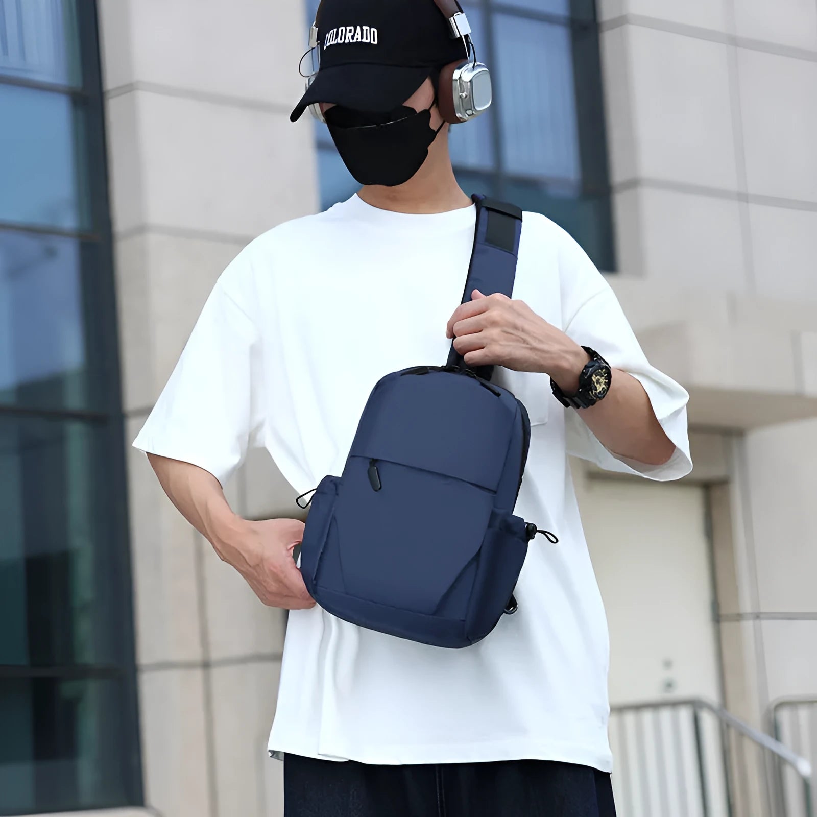 Men's grey waterproof chest bag showing front compartment and shoulder strap