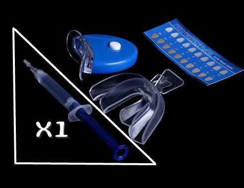 Bright Teeth Whitening Kit with LED cold light device and desensitizing gel syringes on a white background