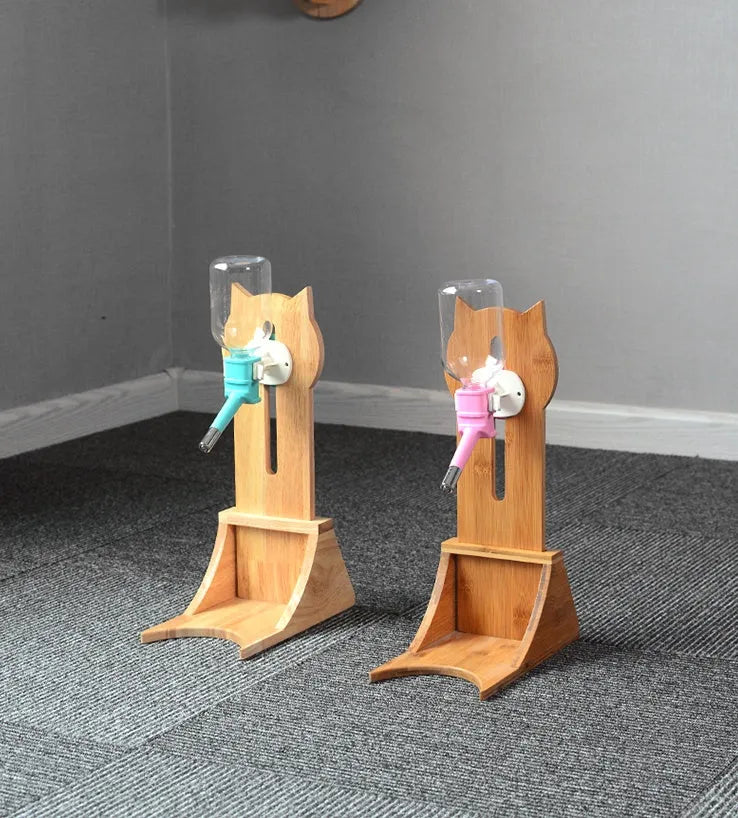 Cat drinking water dispenser with bamboo wood holder and 300ml water container in grey, green, and pink
