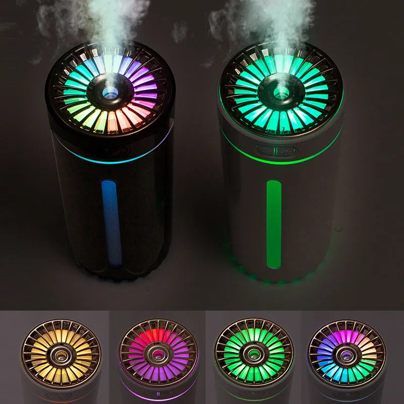 Black wireless portable humidifier with colourful lights beside car cup holder