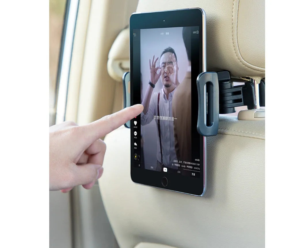 Black universal car phone holder mounted on rear seat base with tablet secured in clamp
