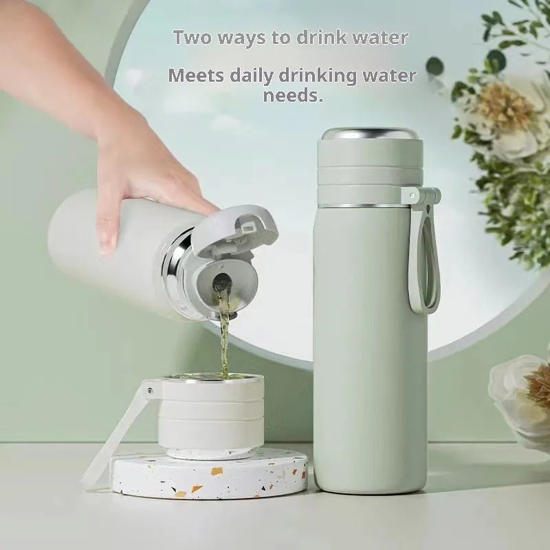 316 stainless steel insulated thermos cup with tea and water separation, in army green, 500ml capacity, on a white background