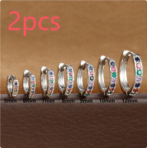 Gold, rose gold, and silver coloured perforated circle zircon stud earrings in various sizes from 5mm to 12mm diameter.