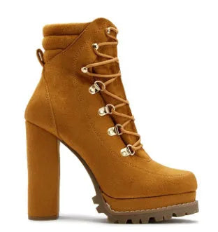 Women's suede ankle boots with a thick high heel, round toe, and buckle detail in army green.