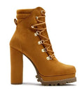 Women's suede ankle boots with a thick high heel, round toe, and buckle detail in army green.