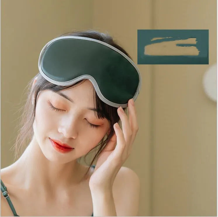 Pink and green suede portable eye spa mask with USB charging for steam heat and vibration massage.