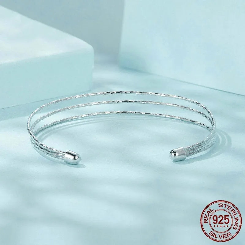 Simple multi-layer 925 sterling silver open-ended bracelet in electroplated colour SCB273 on light background