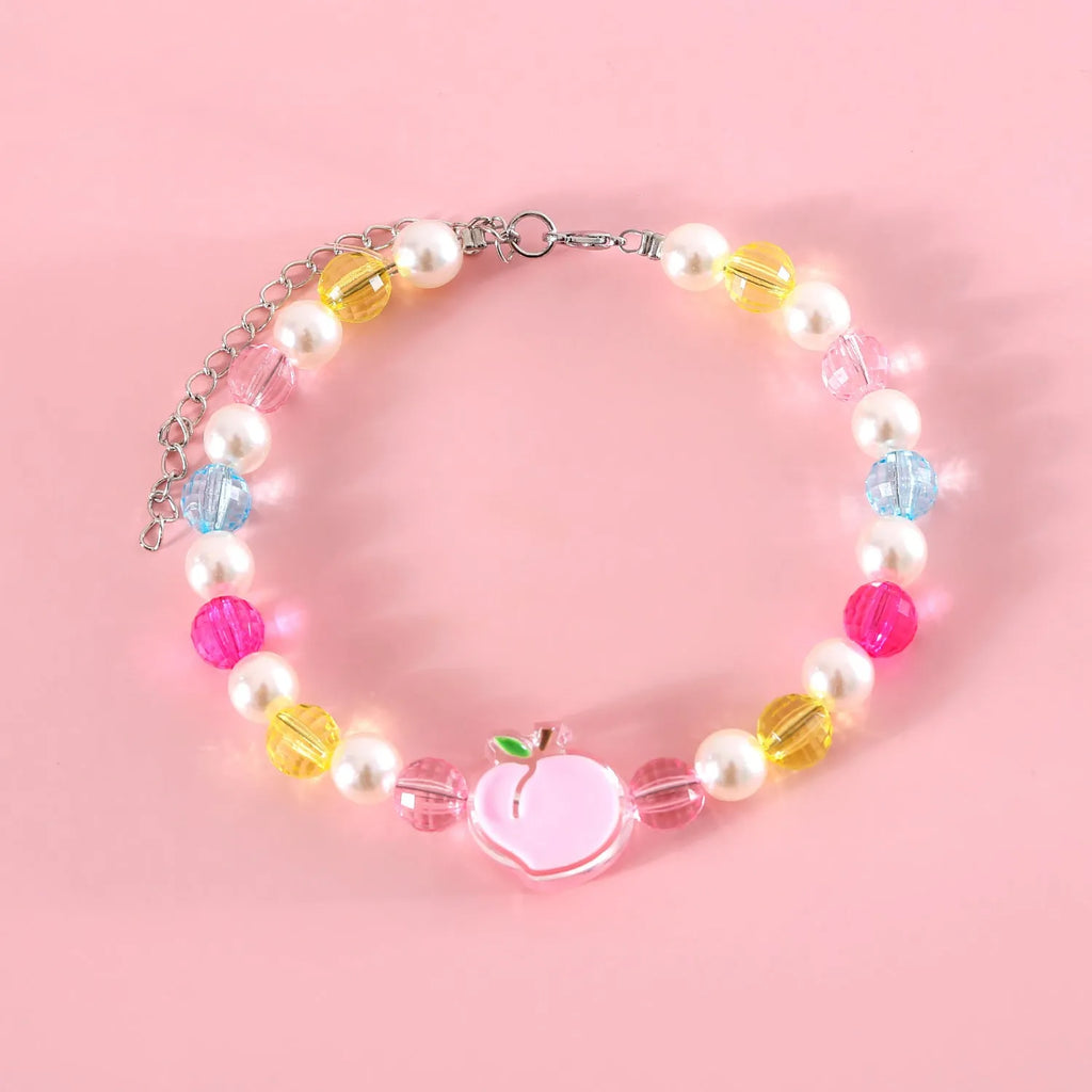 Colourful plastic pearl necklace for small pets on a white background, showing peach, rainbow, and small flower bead design options.