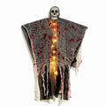 Plastic Halloween decoration of a luminous blood-dyed skull designed as a hanging ghost ornament.