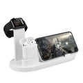 White three-port USB headphone charging stand holding wireless headphones and earbuds