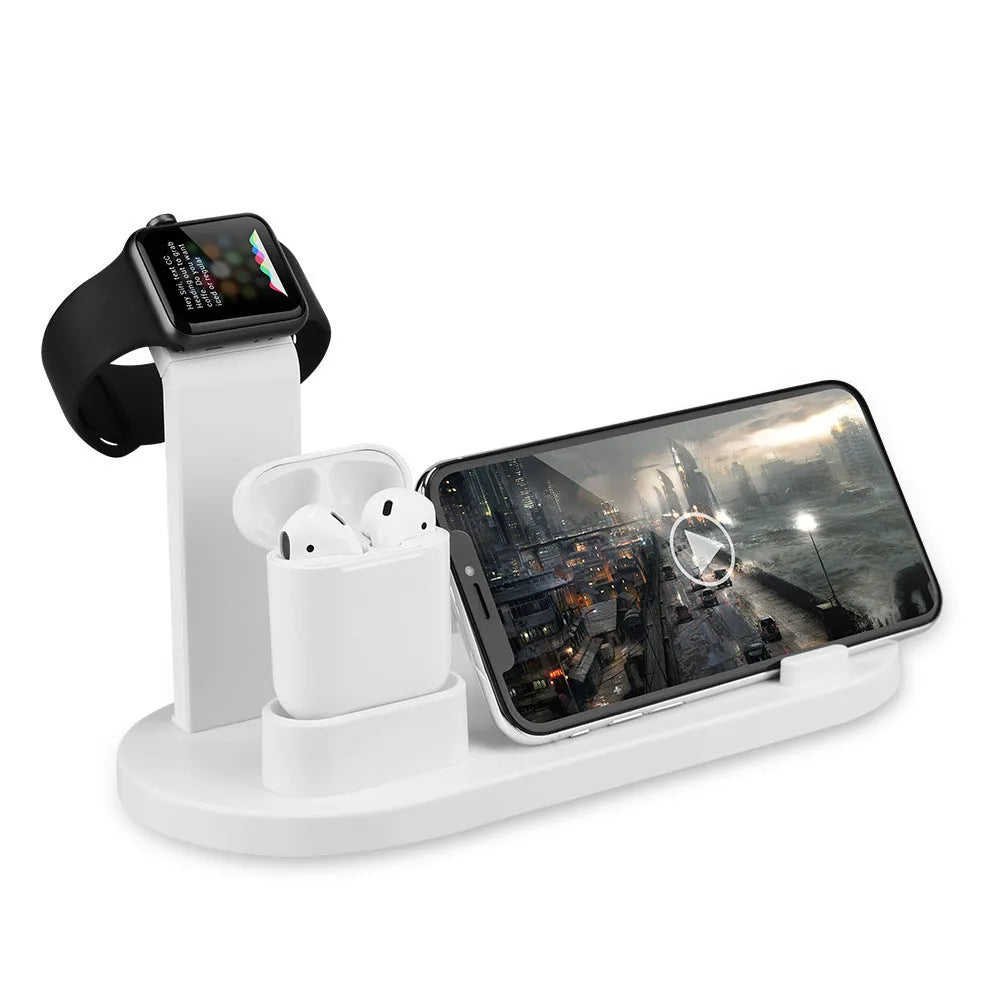 White three-port USB headphone charging stand holding wireless headphones and earbuds