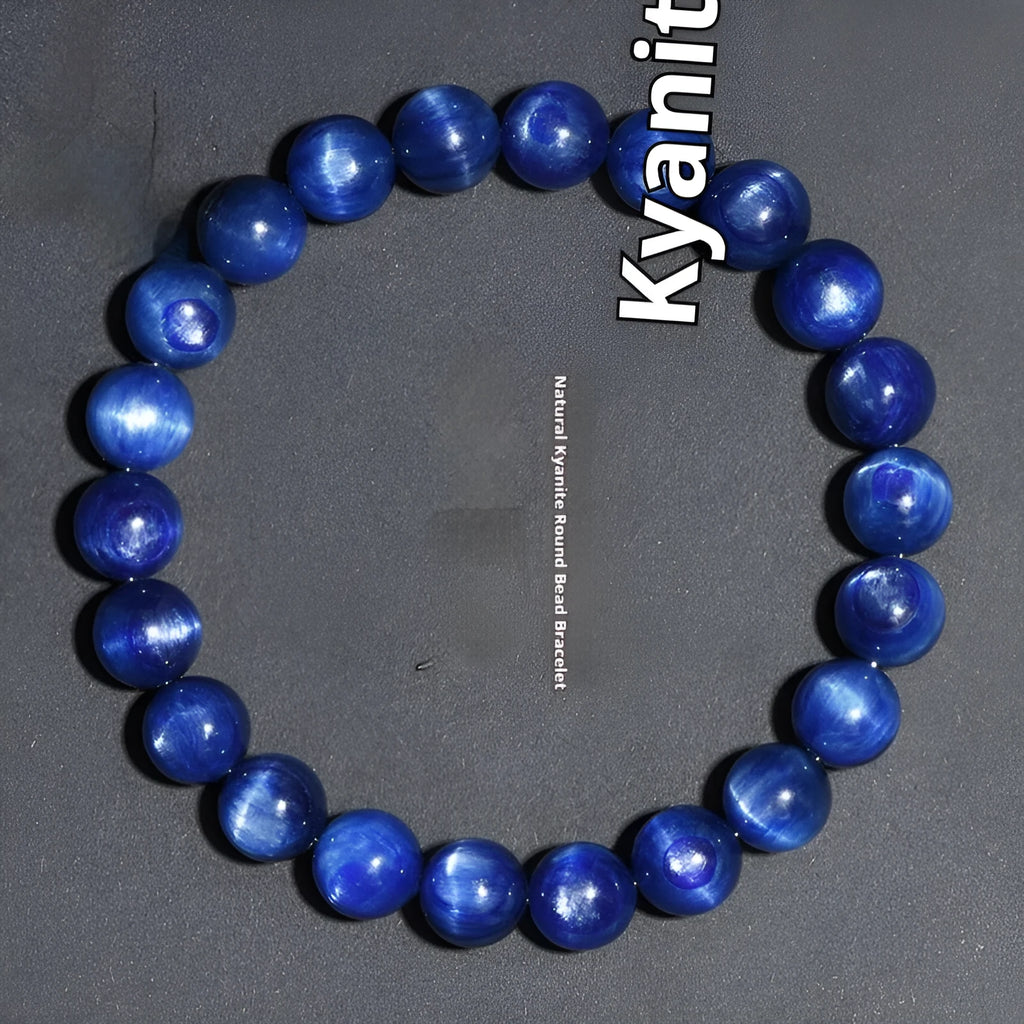 Blue crystal ball bracelet with geometric beads and a Ruyi charm on a white background.