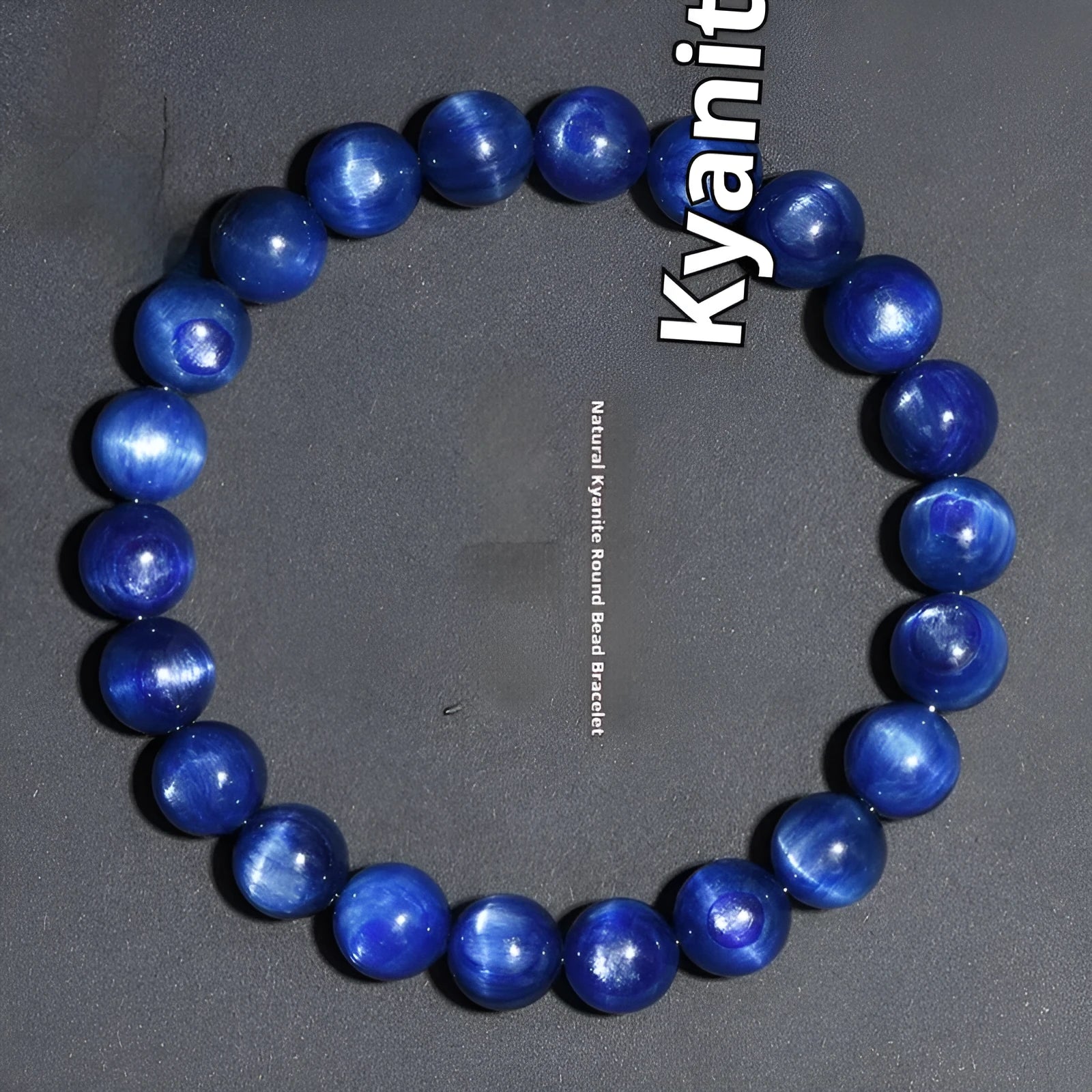 Blue crystal ball bracelet with geometric beads and a Ruyi charm on a white background.
