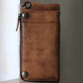 Retro long cowhide wallet with 13 card slots, zipper bill pocket, in bark brown, on flat surface