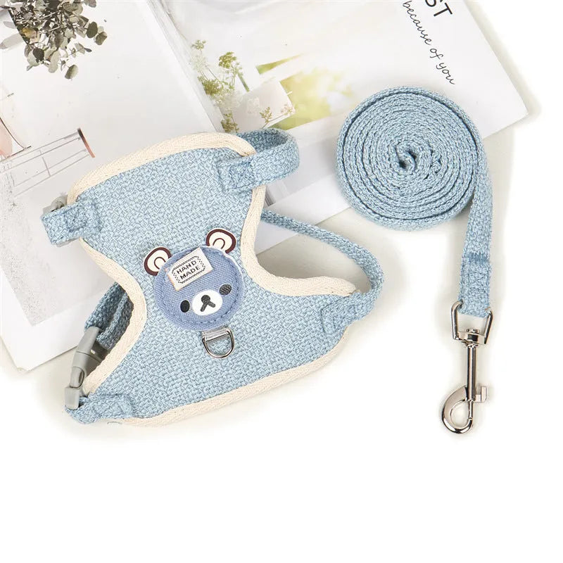 Adjustable dog hand holding rope vest with cloth chest strap and traction rope in beige on a flat surface