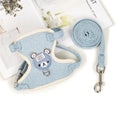 Adjustable dog hand holding rope vest with cloth chest strap and traction rope in beige on a flat surface