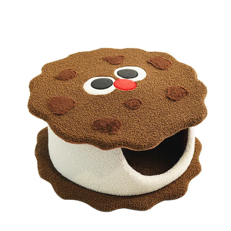 Khaki-coloured closed cat house with a nest shape resembling a sandwich cookie.