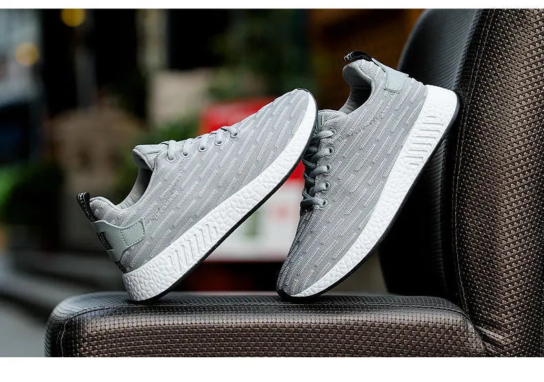 Men's Malcom low-top sneaker with mesh fabric upper and MD sole in black, grey, and white