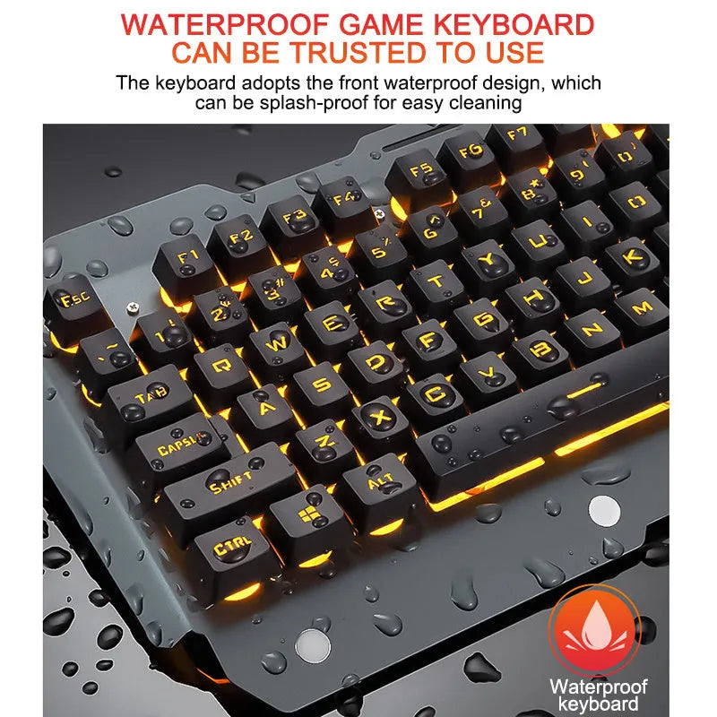 Black wired gaming keyboard with RGB backlight, phone holder, pen tray, and magnetic wrist rest on a desk