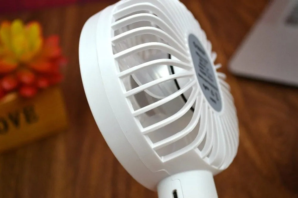 White ORICO FH1 portable USB rechargeable small fan on a desk