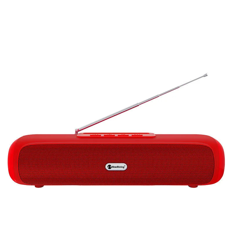 Long, slim wireless desktop Bluetooth speaker in black, shown on a wooden desk.