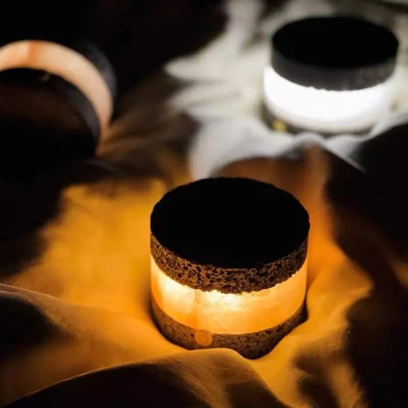 Small orange volcanic rock touch lamp with USB port and essential oil well in warm white.