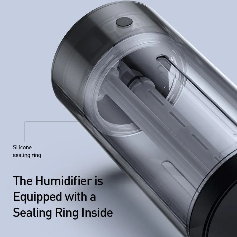 Black aluminium alloy car humidifier and air purifier with USB cable on a car dashboard.