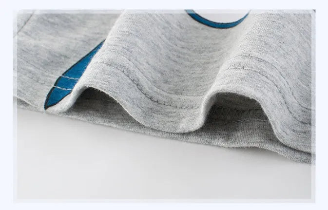 Grey children's cotton T-shirt laid flat, showing size tag with centimetre measurements.