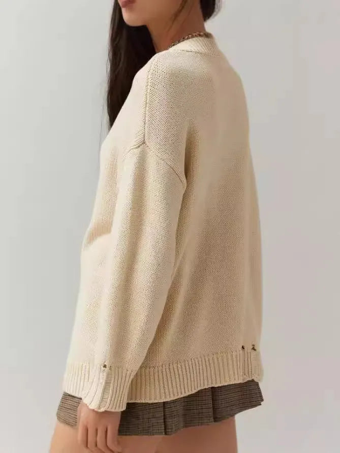 Women's loose-fitting Milky White acrylic pullover sweater with Jacquard pattern and round neck.